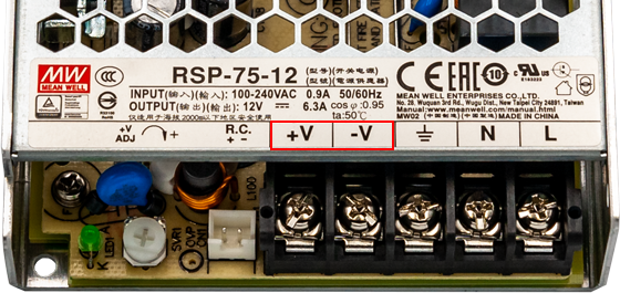 明纬电源供应器输出端负极标示-V或COM差异为何?